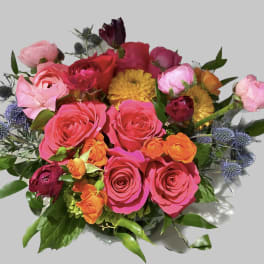 Bright mixed bouquet of pink, red, orange, and yellow flowers