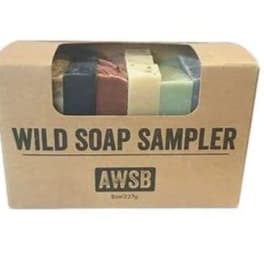 Boxed wild soap sampler with four colored bars visible through a window