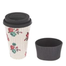 Floral-patterned takeaway coffee cup with a black lid and sleeve