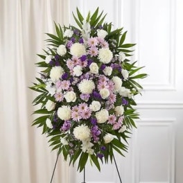 Standing floral spray with white, pink, and purple flowers