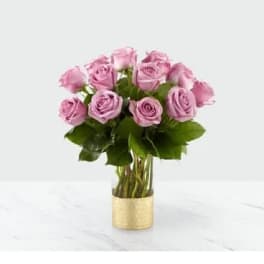 Pink roses arranged in a gold vase