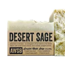 Rectangular bar of speckled desert sage soap wrapped in a kraft paper label