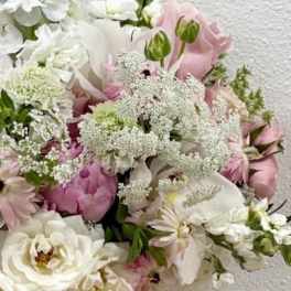 Bouquet of white and pale pink flowers with airy filler blooms