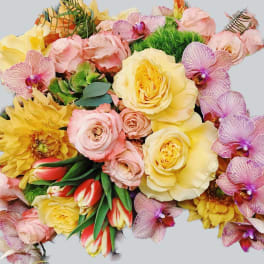Mixed bouquet of yellow and pink roses with orchids and tulips