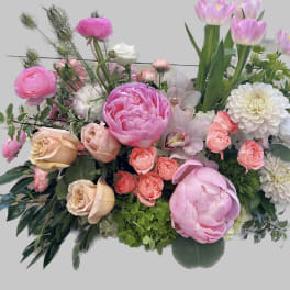 Mixed bouquet of pink and white flowers with tall pink tulips