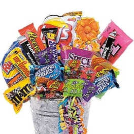 Bucket filled with assorted candy bars and colorful streamers