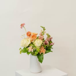 Mixed pastel bouquet in a white vase