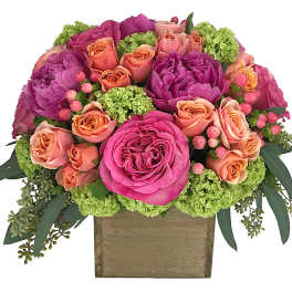 Pink and peach rose arrangement in a square wooden box