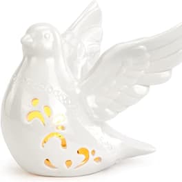 White ceramic dove figurine with wing details and yellow cutout accents