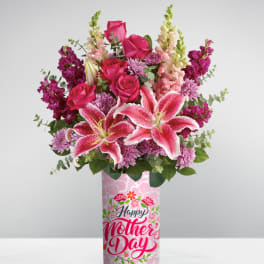 Tall pink Mother’s Day vase with pink lilies, roses, snapdragons, and mums