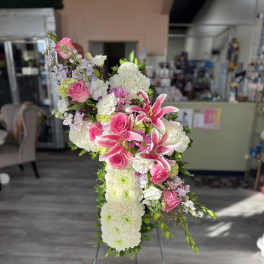 Pink and white floral standing spray on an easel