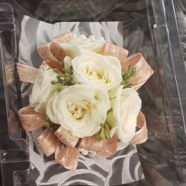 White rose boutonniere and matching white rose corsage with pink ribbon