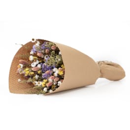 Wrapped bouquet of small dried flowers in pastel colors
