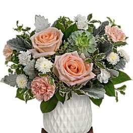 Peach roses and white daisies in a white vase