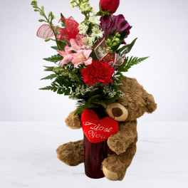 Bouquet with red rose, pink flowers, and teddy bear holding a heart