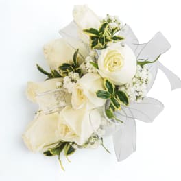 Bouquet of white roses with white ribbon and small white filler flowers