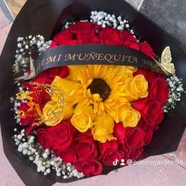 Bouquet of red and yellow roses with a sunflower and black wrap