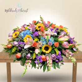 Large mixed bouquet with sunflowers, roses, lilies, and hydrangeas