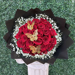 Bouquet of red roses with white baby's breath and gold butterfly accents