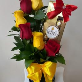 Red and yellow roses with a Ferrero Rocher gift box and ribbon