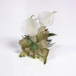 Small white calla lily corsage with gold ribbon bow on a white background