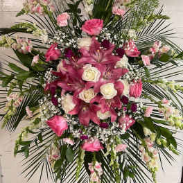 Pink lilies and white roses in a large standing spray