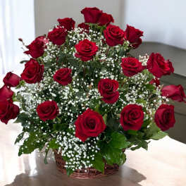 Basket of red roses with white baby's breath