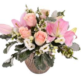 Pink lilies and roses in a glass vase
