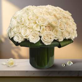 White rose bouquet in a dark green vase