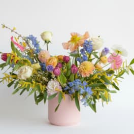 Colorful mixed bouquet in a pink vase