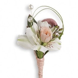 Small boutonniere with white flowers and a blush rose