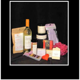Gift set with wine, chocolates, candles, soap, and spa items