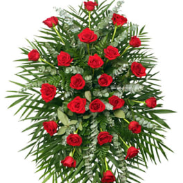 Standing spray of red roses with palm fronds and eucalyptus