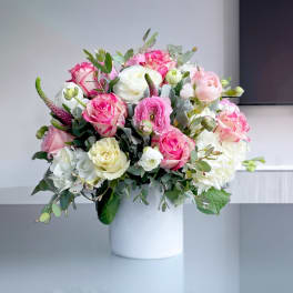 Pink and white mixed bouquet in a white vase