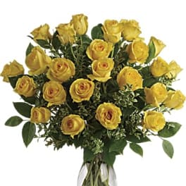 Yellow roses arranged in a clear glass vase