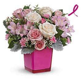 Pink and white rose bouquet in a magenta vase with a pink ribbon