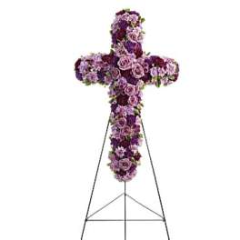 Purple floral cross on a metal easel