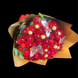 Bouquet of red roses with gold accents and butterfly decorations