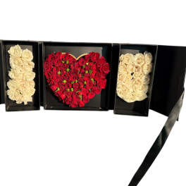Heart-shaped red rose box with two cream rose panels in a black gift box