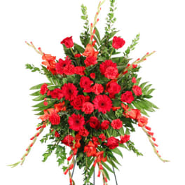 Large red floral standing spray on an easel