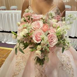 Bride holding a large pink and white bouquet