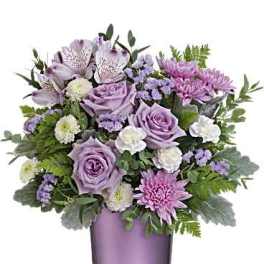 Lavender and pink bouquet in a purple glass vase