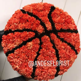 Basketball-shaped arrangement of orange carnations with black accents