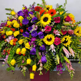 Large mixed bouquet with roses, sunflowers, lilies, and snapdragons