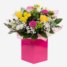 Mixed bouquet in a bright pink gift box
