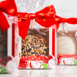 Wrapped chocolate gift boxes tied with red bows