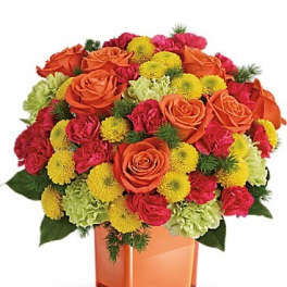 Orange roses and yellow pompons in a square glass vase