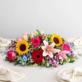 Colorful bouquet with sunflowers, roses, lilies, and gerbera daisies