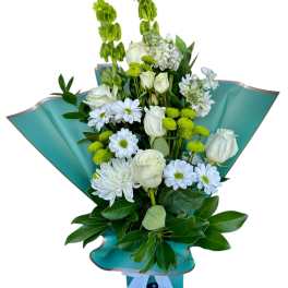 Bouquet of white roses and daisies with green accents in teal wrap