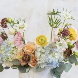 Pastel bouquet with hydrangeas, roses, and small mixed blooms